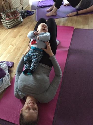 yoga pose with baby on lap